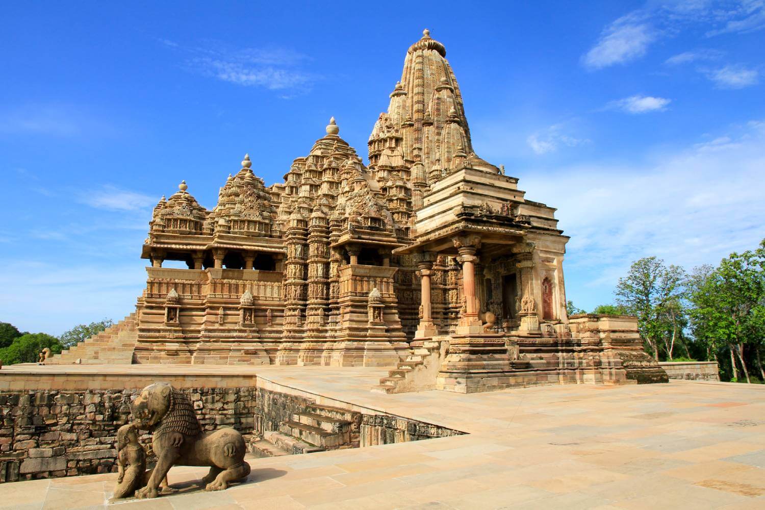 Sandstone temple at Khajuraho under a blue sky